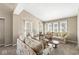 Bright living room with vaulted ceilings and multiple windows for ample natural light at 4947 Cherryhill Ct, Indianapolis, IN 46254