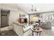 Comfortable living room with neutral tones, vaulted ceiling, fireplace and large windows at 4947 Cherryhill Ct, Indianapolis, IN 46254