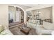 Spacious living room with a staircase, arched doorways, and comfortable seating arrangements at 4947 Cherryhill Ct, Indianapolis, IN 46254