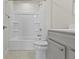 Bathroom featuring a shower and bathtub combo with a gray vanity at 5147 Gerhing Dr, Indianapolis, IN 46239
