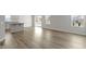 Dining area featuring wood floors with windows and a glass sliding door at 5147 Gerhing Dr, Indianapolis, IN 46239