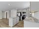 Bright kitchen featuring stainless steel appliances, granite countertops, and an island with a breakfast bar at 5147 Gerhing Dr, Indianapolis, IN 46239