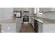 Bright kitchen featuring stainless steel appliances, granite countertops, and an island with a breakfast bar at 5147 Gerhing Dr, Indianapolis, IN 46239