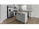 Bright kitchen featuring stainless steel appliances, granite countertops, and an island with a breakfast bar at 5147 Gerhing Dr, Indianapolis, IN 46239