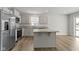 Bright kitchen featuring stainless steel appliances, granite countertops, and an island with a breakfast bar at 5147 Gerhing Dr, Indianapolis, IN 46239
