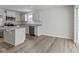 An open kitchen with white cabinets and stainless steel appliances at 5147 Gerhing Dr, Indianapolis, IN 46239
