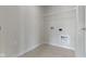 An empty laundry room with tile floors and a wire shelf at 5147 Gerhing Dr, Indianapolis, IN 46239