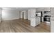 Living room with wood floors leading into the kitchen and dining area at 5147 Gerhing Dr, Indianapolis, IN 46239