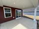 View of a covered patio and sliding glass door, perfect for seamless indoor-outdoor living at 5147 Gerhing Dr, Indianapolis, IN 46239