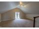 Attic featuring carpeting and a dormer window, offering potential for a bonus room at 5752 River Rd, Waldron, IN 46182