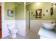 Charming bathroom featuring a vessel sink, beadboard wainscoting, and a walk-in shower at 5752 River Rd, Waldron, IN 46182