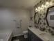 Updated bathroom with double sinks, modern fixtures, and stylish tile accents at 5810 Grand Ave, Plainfield, IN 46168