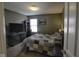 Bedroom featuring dark furniture, neutral carpet, and natural light at 5810 Grand Ave, Plainfield, IN 46168