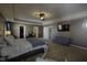 Spacious bedroom with seating, TV and bed. It is filled with natural light at 5810 Grand Ave, Plainfield, IN 46168