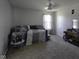 Well-lit bedroom with a daybed, side table, and decorative pillows, plus a TV on dresser at 5810 Grand Ave, Plainfield, IN 46168