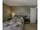 Bedroom with neutral carpet and a patchwork quilt, offering a cozy and comfortable retreat at 5810 Grand Ave, Plainfield, IN 46168