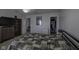 Comfortable bedroom features neutral walls, carpet floors, ceiling fan, and closet access at 5810 Grand Ave, Plainfield, IN 46168