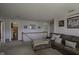 Upstairs bonus room showcasing cozy seating and access to a full bathroom at 5810 Grand Ave, Plainfield, IN 46168