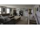 Large bonus room features comfortable seating, study area, and ample natural light at 5810 Grand Ave, Plainfield, IN 46168
