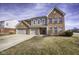 Stunning two-story brick home with a spacious three-car garage and well-maintained front yard at 5810 Grand Ave, Plainfield, IN 46168