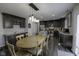 A well-lit kitchen shows dark cabinets, stainless steel appliances, and an adjacent dining area at 5810 Grand Ave, Plainfield, IN 46168