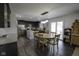 A kitchen and dining area showcase dark wood cabinets, stainless steel appliances, and modern pendant lighting at 5810 Grand Ave, Plainfield, IN 46168