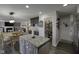 A kitchen island, wooden dining table, and open pantry enhance the functionality and appeal of this space at 5810 Grand Ave, Plainfield, IN 46168