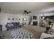 Open-concept living room flows into the kitchen with a neutral palette and ample natural light at 5810 Grand Ave, Plainfield, IN 46168