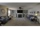 Cozy living room with fireplace, built-in shelving, neutral decor, and comfortable seating at 5810 Grand Ave, Plainfield, IN 46168