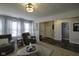 Inviting living room with comfortable seating, large windows, and stylish decor at 5810 Grand Ave, Plainfield, IN 46168