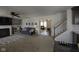 Open-concept living room with a fireplace, comfortable seating, and seamless flow to the upper level at 5810 Grand Ave, Plainfield, IN 46168