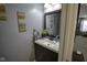 Stylish powder room featuring a modern vanity, elegant mirror, and tasteful decor at 5810 Grand Ave, Plainfield, IN 46168