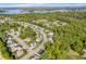 Picturesque aerial view of a neighborhood near a lake surrounded by lush greenery at 6504 W May Apple Dr, McCordsville, IN 46055