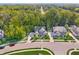 Stunning aerial view of a home with mature landscaping and a spacious driveway at 6504 W May Apple Dr, McCordsville, IN 46055