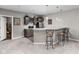 Finished basement with a wet bar that features pendant lighting and seating at 6504 W May Apple Dr, McCordsville, IN 46055