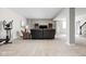 Finished basement area with comfortable seating, large tv, and stair access at 6504 W May Apple Dr, McCordsville, IN 46055