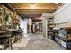 Spacious unfinished basement area with exposed beams and ample storage shelving at 6504 W May Apple Dr, McCordsville, IN 46055