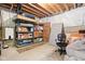 Unfinished basement storage area with shelving units and room for organization at 6504 W May Apple Dr, McCordsville, IN 46055