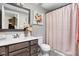 Charming bathroom with a stylish vanity, decorative mirror, and shower with a decorative curtain at 6504 W May Apple Dr, McCordsville, IN 46055