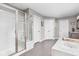 Bright bathroom featuring a soaking tub, modern finishes, a walk-in shower, and neutral walls at 6504 W May Apple Dr, McCordsville, IN 46055