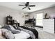 Bedroom showcasing a bed with decorative pillows, complemented by modern shelving and ample natural light at 6504 W May Apple Dr, McCordsville, IN 46055