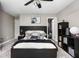 Bedroom featuring a king-size bed, dark wood accents, and a well-organized bookshelf creating a cozy retreat at 6504 W May Apple Dr, McCordsville, IN 46055