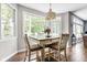 Cozy breakfast nook with a wooden table, chairs, natural light, and views of the backyard at 6504 W May Apple Dr, McCordsville, IN 46055