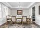 Elegant dining room with stylish chandelier, tray ceiling, and decorative rug at 6504 W May Apple Dr, McCordsville, IN 46055