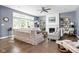 Comfortable living room with large windows, a fireplace, built-in shelving, and stylish furnishings at 6504 W May Apple Dr, McCordsville, IN 46055