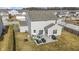 Aerial view showcases home's backyard with patio, seating, and fenced perimeter at 6705 Park Grove Blvd, Whitestown, IN 46075