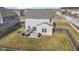 Aerial view of a home with fenced backyard, patio, seating, and landscaping at 6705 Park Grove Blvd, Whitestown, IN 46075