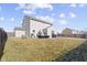 Expansive, fenced backyard with patio, seating, and well-maintained lawn at 6705 Park Grove Blvd, Whitestown, IN 46075
