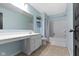 Bathroom featuring blue walls, a large vanity, a shower-tub combo, and tiled floors at 6705 Park Grove Blvd, Whitestown, IN 46075