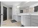 Elegant bathroom with double vanity, a large mirror, and modern fixtures, providing a functional space at 6705 Park Grove Blvd, Whitestown, IN 46075